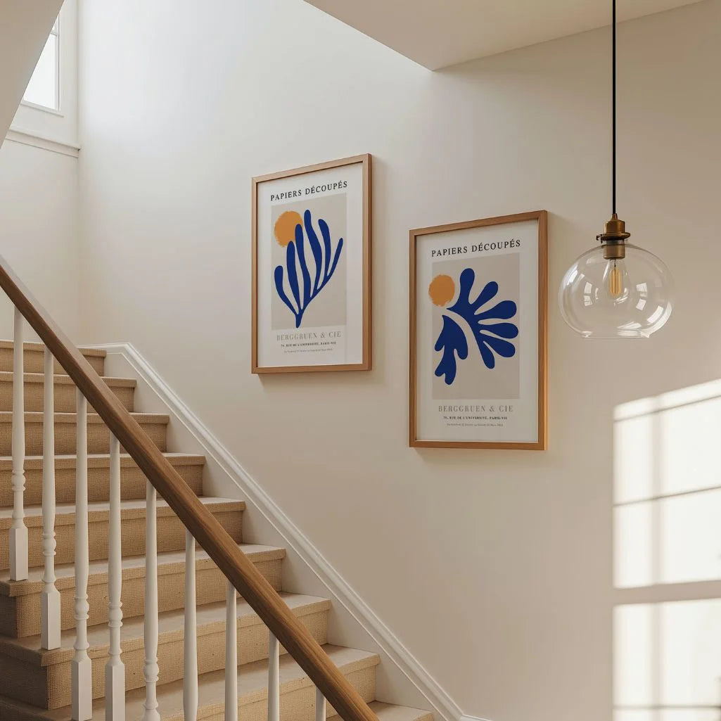 Set of 2 blue cutouts posters arranged in gallery wall with modern abstract decor