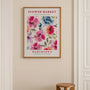 Colorful flower watercolor poster styled in bright living room interior