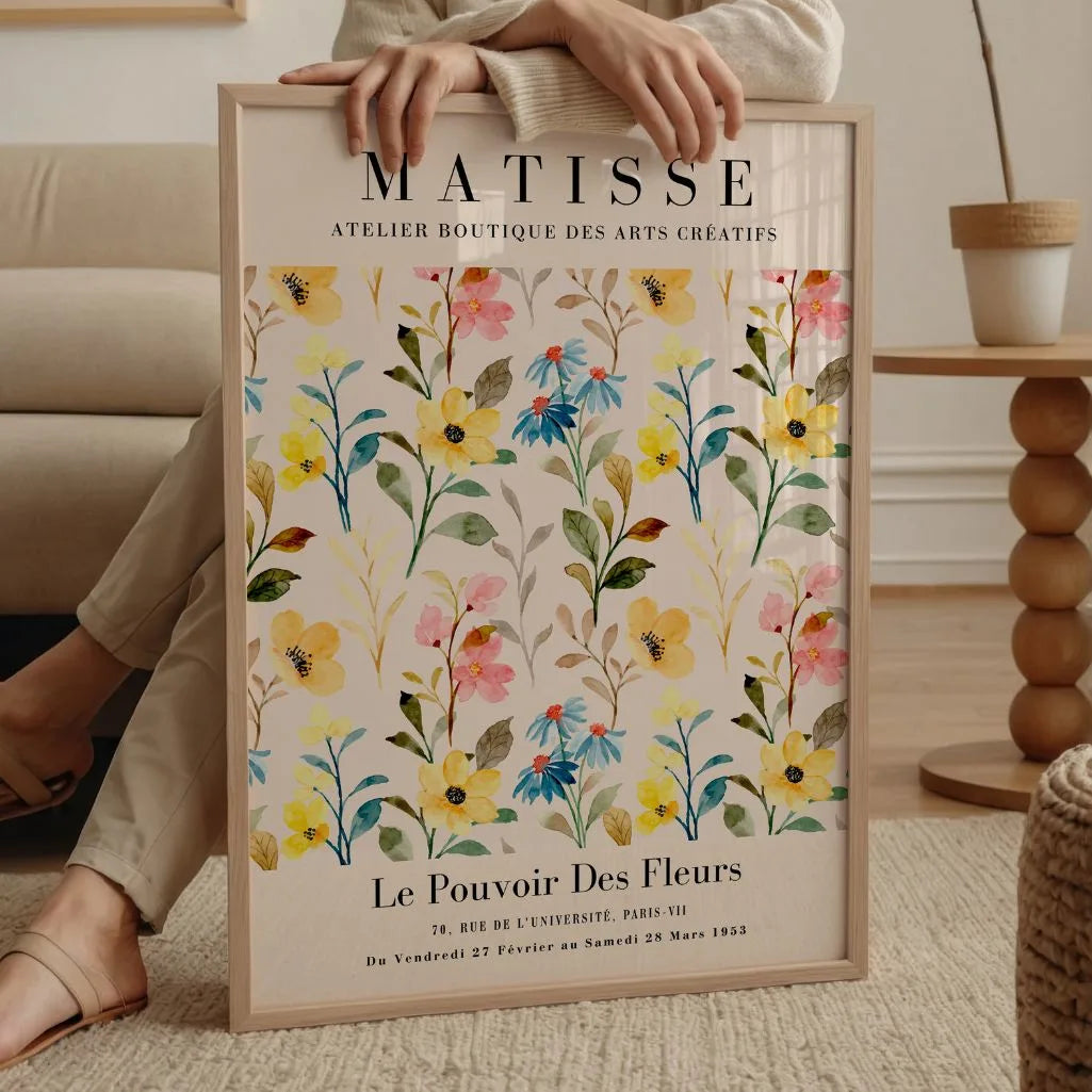 Watercolour meadow poster with soft flowers styled in modern dining room interior