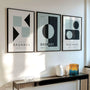 green grey and black bauhaus poster set arranged in modern gallery wall